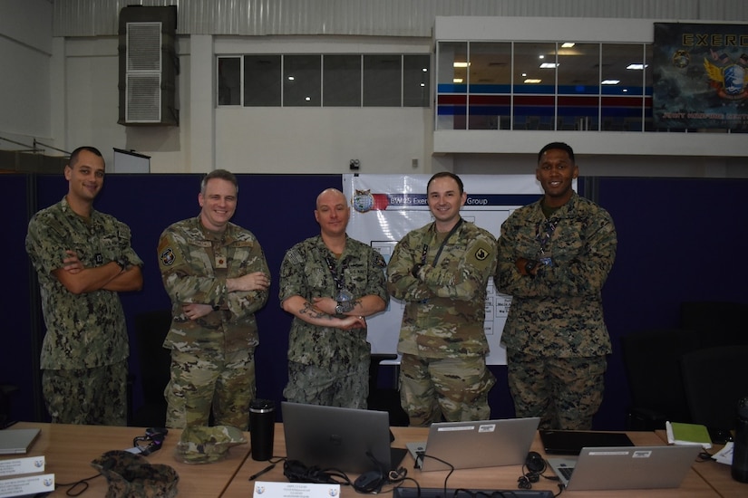 Members of the U.S. Air Force, Navy, Army, and Marine Corps pose for a group photo at the Joint Warfighting Center, Kuantan, Malaysia, June 23, 2025.