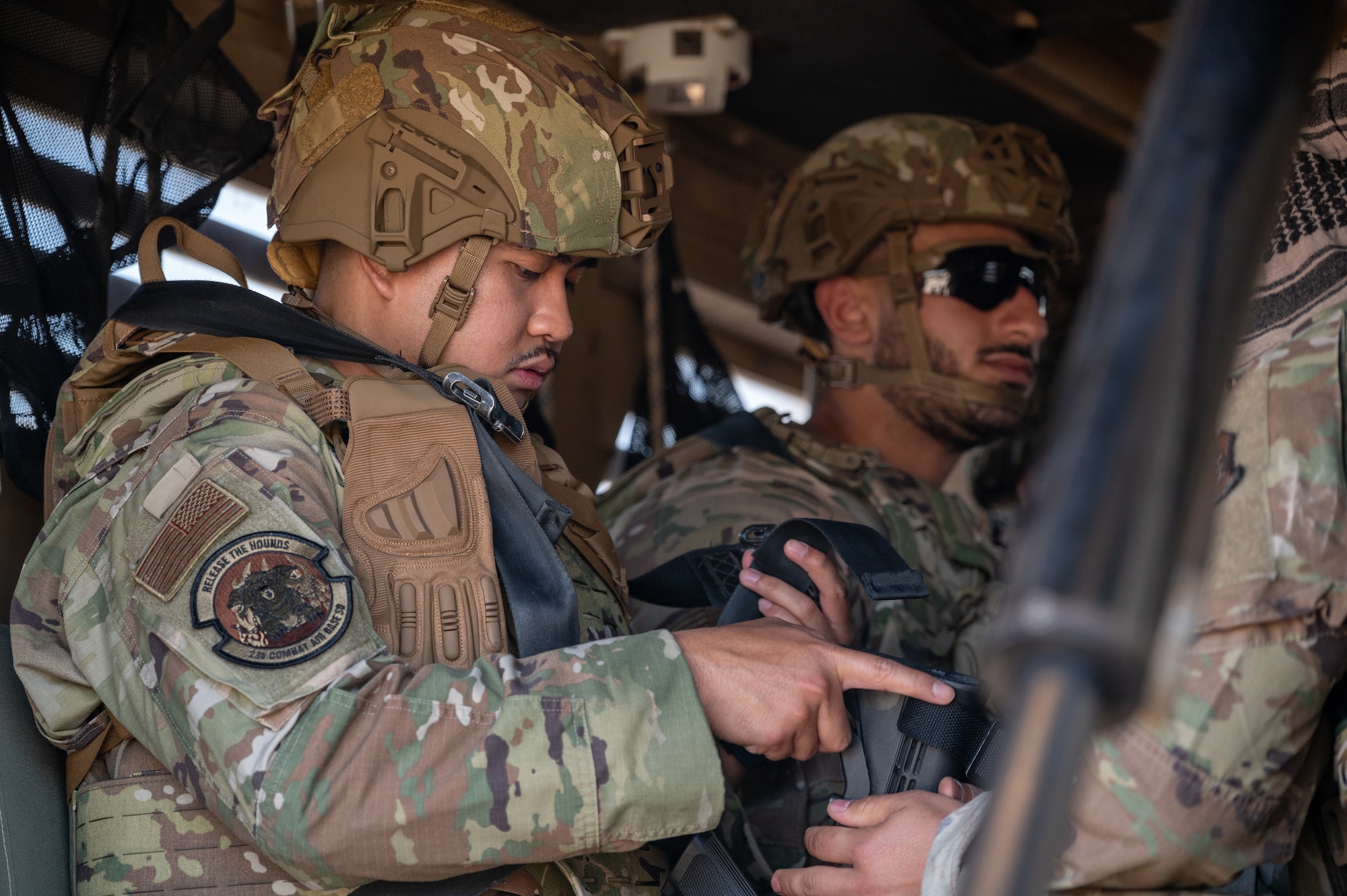 Airmen assigned to the 23d Combat Air Base Squadron strap into a Humvee Egress Assistance Trainer for vehicle rollover training during an expeditionary skills exercise at Fort Bliss, Texas, June 8, 2025.
