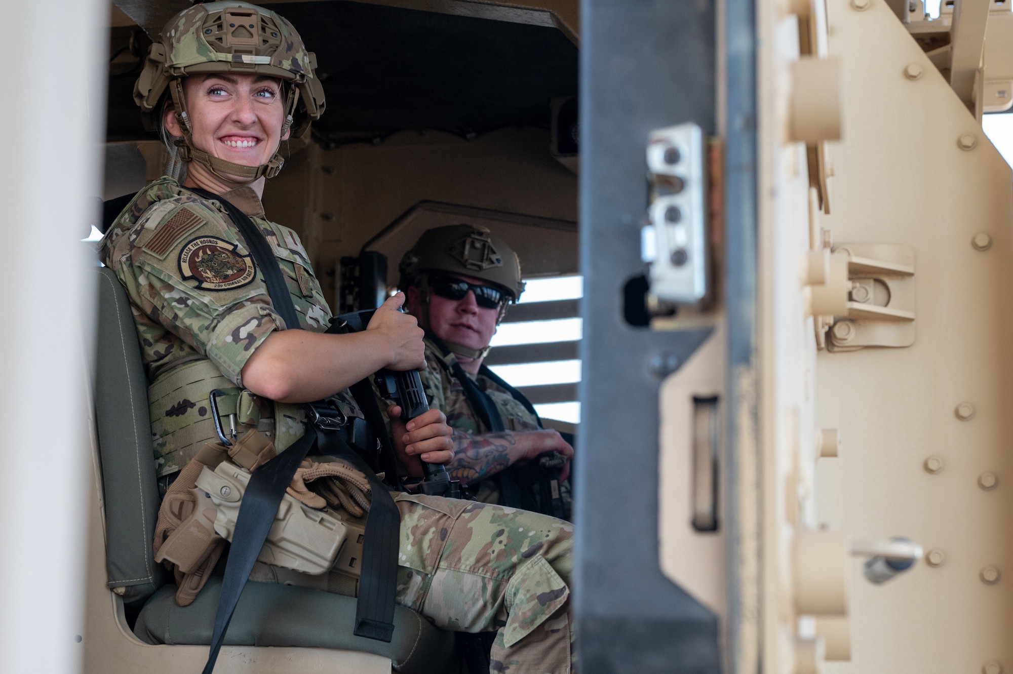 Airmen assigned to the 23d Combat Air Base Squadron strap into a Humvee Egress Assistance Trainer for vehicle rollover training during an expeditionary skills exercise at Fort Bliss, Texas, June 8, 2025.