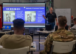 Brett Stohr, InSource Fire Training president, teaches strategies and tactics during Osan’s first bilingual InSource Consulting Fire Training at Osan Air Base, Republic of Korea, June 18, 2025. The course was conducted in both English and Korean, with a live translator to help ensure key concepts were clearly communicated.(U.S. Air Force photo by Staff Sgt. Sarah Williams)