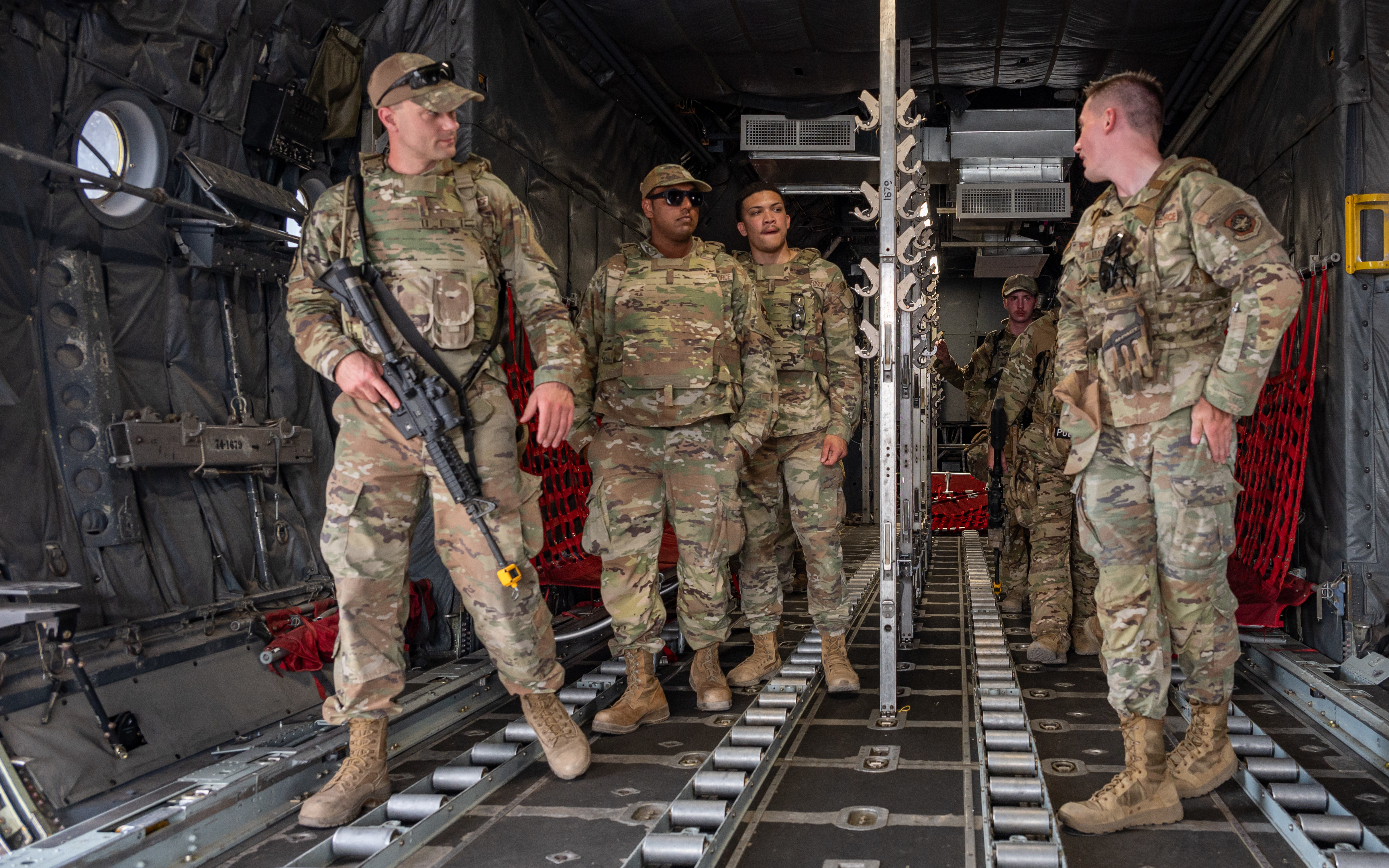 Airmen assigned to the 23d Combat Air Base Squadron demonstrate aircraft cargo loading and unloading procedures for fellow Airmen during an expeditionary skills exercise at Fort Bliss, Texas, June 10, 2025. The expeditionary skills exercise enhanced deployment readiness by training Airmen to operate in austere environments and perform tasks outside their primary career fields, reinforcing the Multi-Capable Airmen concept. (U.S. Air Force photo by Senior Airman Leighton Lucero)