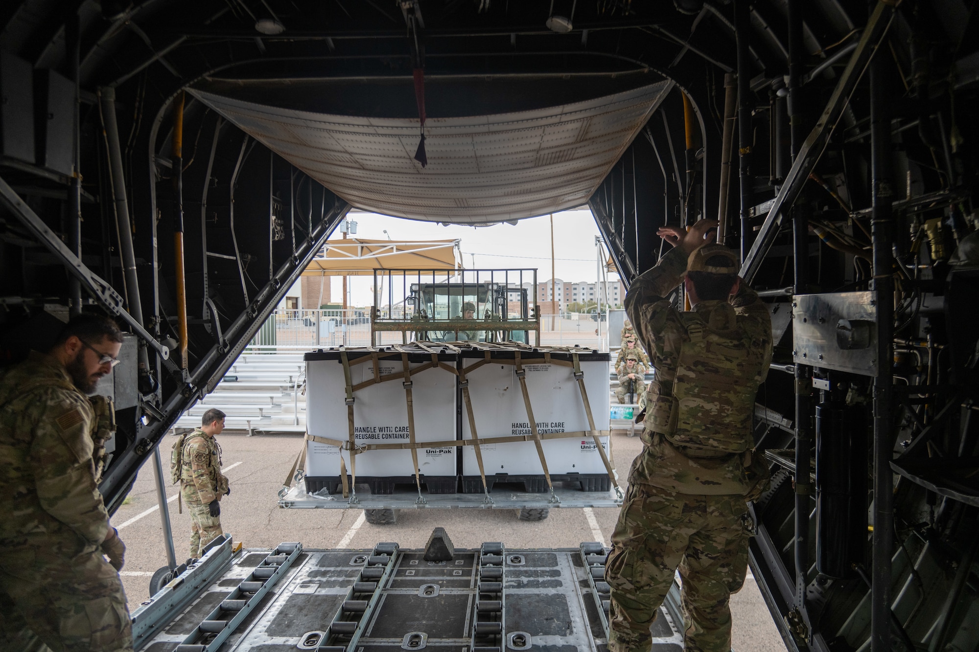 Airmen assigned to the 23d Combat Air Base Squadron demonstrate aircraft cargo loading and unloading procedures for fellow Airmen during an expeditionary skills exercise at Fort Bliss, Texas, June 10, 2025.