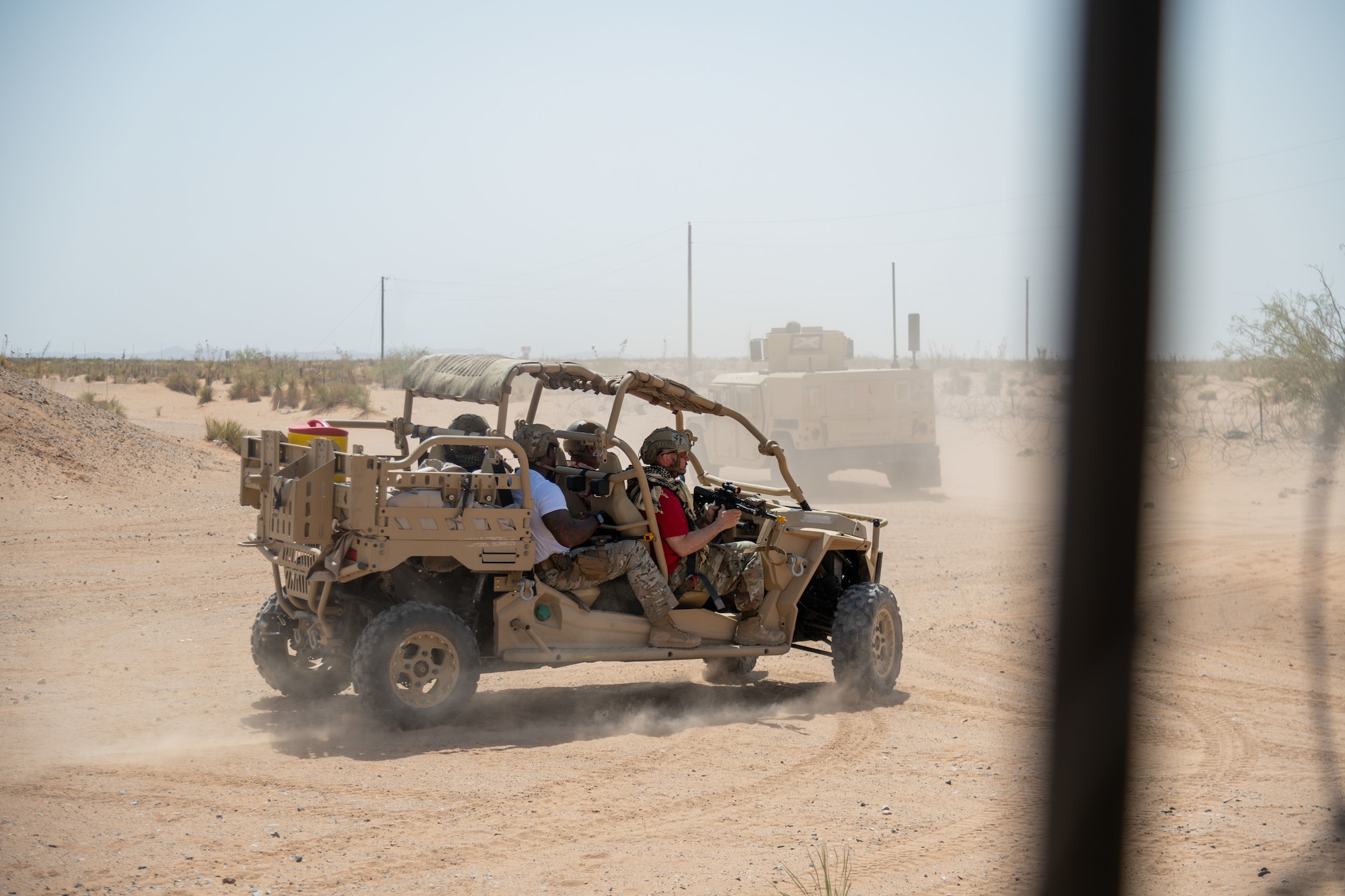 Airmen assigned to the 23d Air Task Force act as enemies attacking a forward operating base during an expeditionary skills exercise at Fort Bliss, Texas, June 16, 2025.
