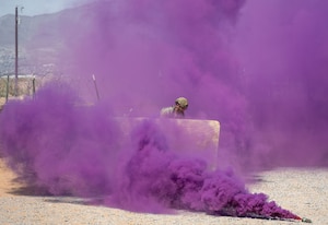 Airmen assigned to the 23d Air Task Force take cover from enemy attacks while demonstrating base defense tactics during an expeditionary skills exercise at Fort Bliss, Texas, June 16, 2025.