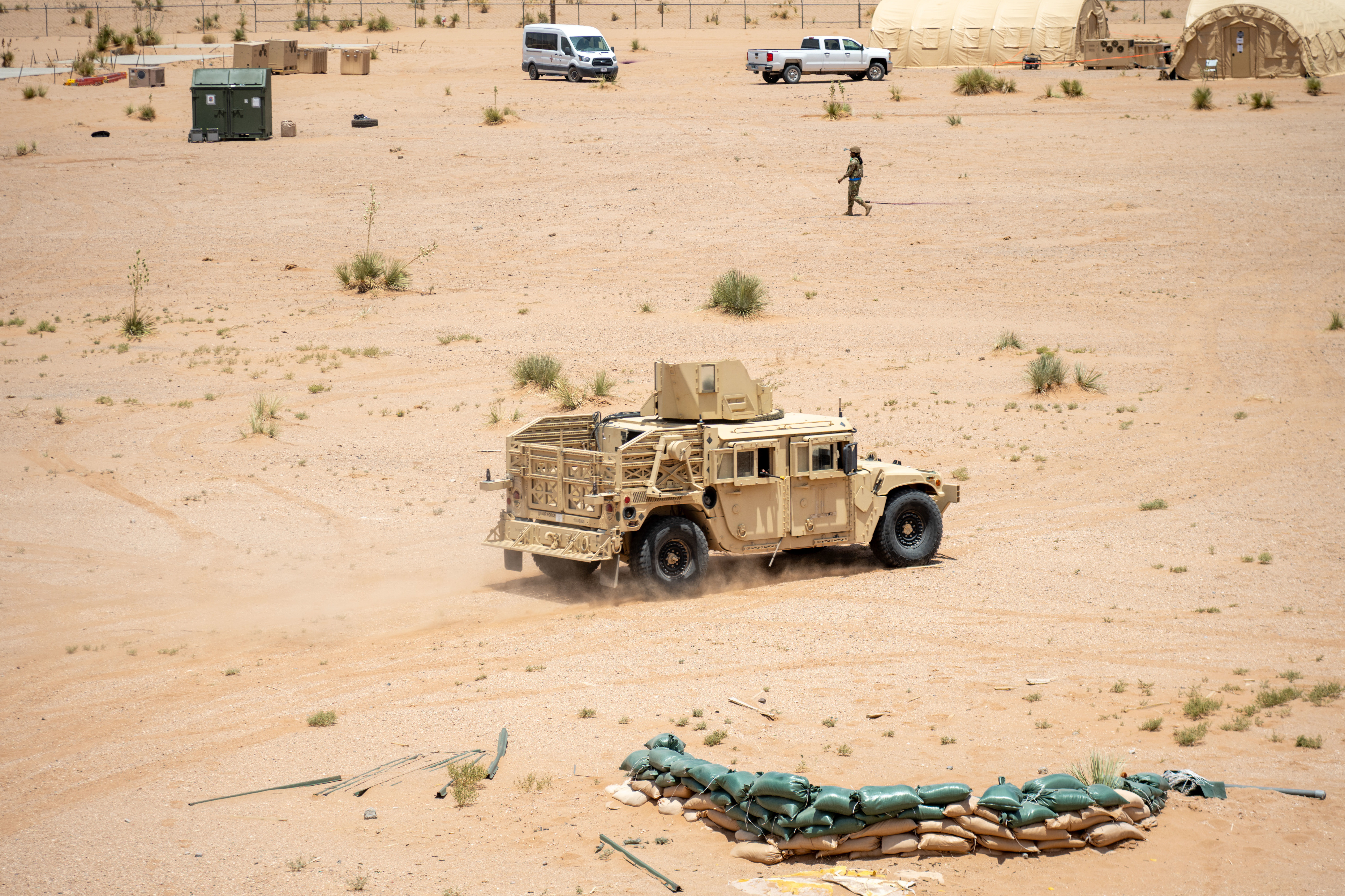 Airmen assigned to the 23rd Air Task Force operate military defense vehicles to repel simulated enemy attacks during an expeditionary skills exercise at Fort Bliss, Texas, June 16, 2025. The expeditionary skills exercise enhanced deployment readiness by training Airmen to operate in austere environments and perform tasks outside their primary career fields, reinforcing the Mission Ready Airmen concept. (U.S. Air Force photo by 2nd Lt. Jason Pannell)