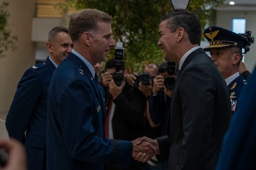 U.S. Air Force Maj. Gen. David Mineau, Air Forces Southern commander, (left), and Santiago Peña, President of the Republic of Paraguay, shake hands during the 65th Conference of the American Air Chiefs meeting in Asuncion, Paraguay, June 18, 2025. The relationships forged during CONJEFAMER serve as the foundation for stronger cooperation, enabling air forces across the Americas to respond more effectively to shared challenges and humanitarian crises. (U.S. Air Force photo by Andrea Jenkins)
