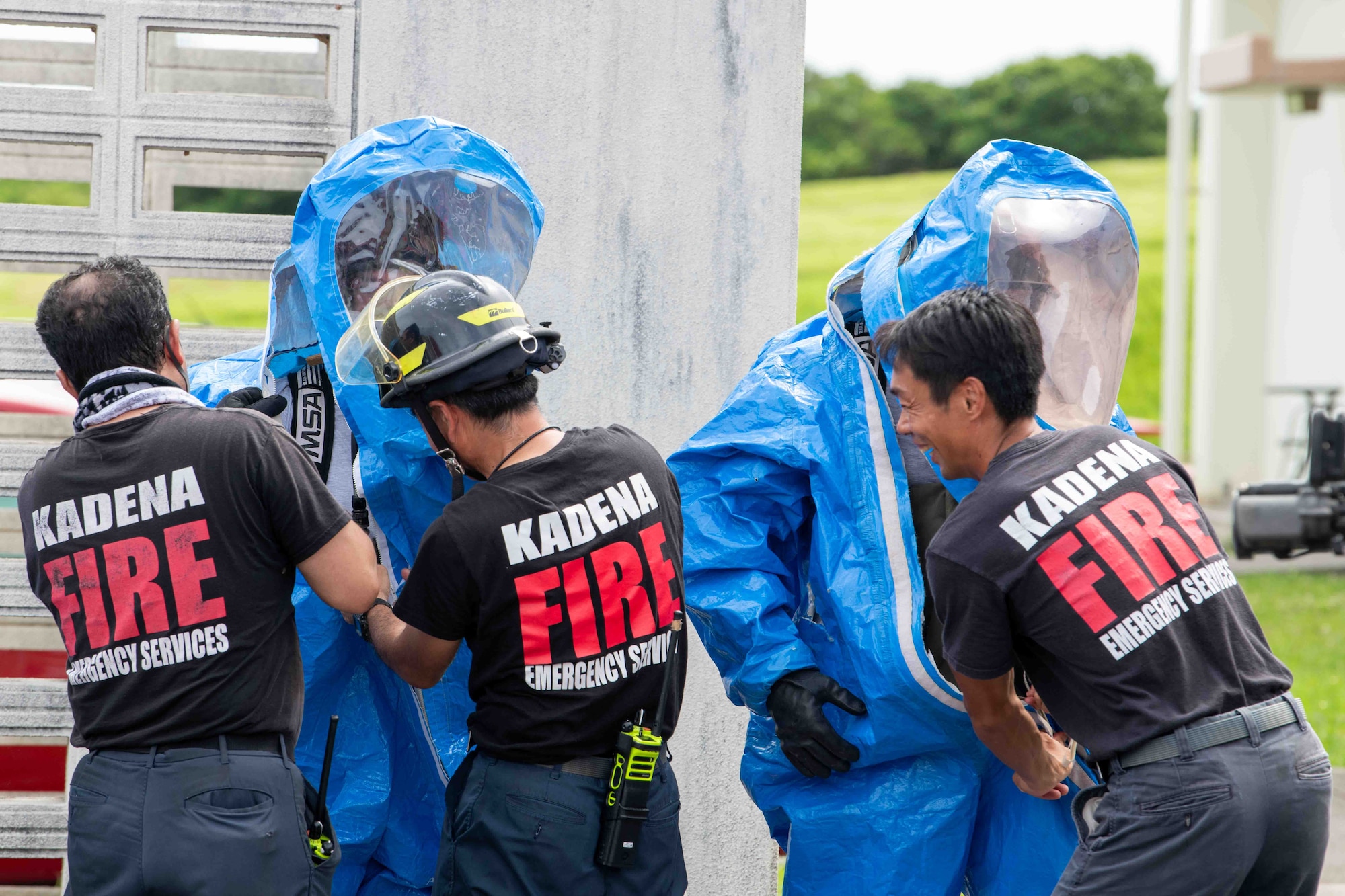 firefighters and service members work together during a training