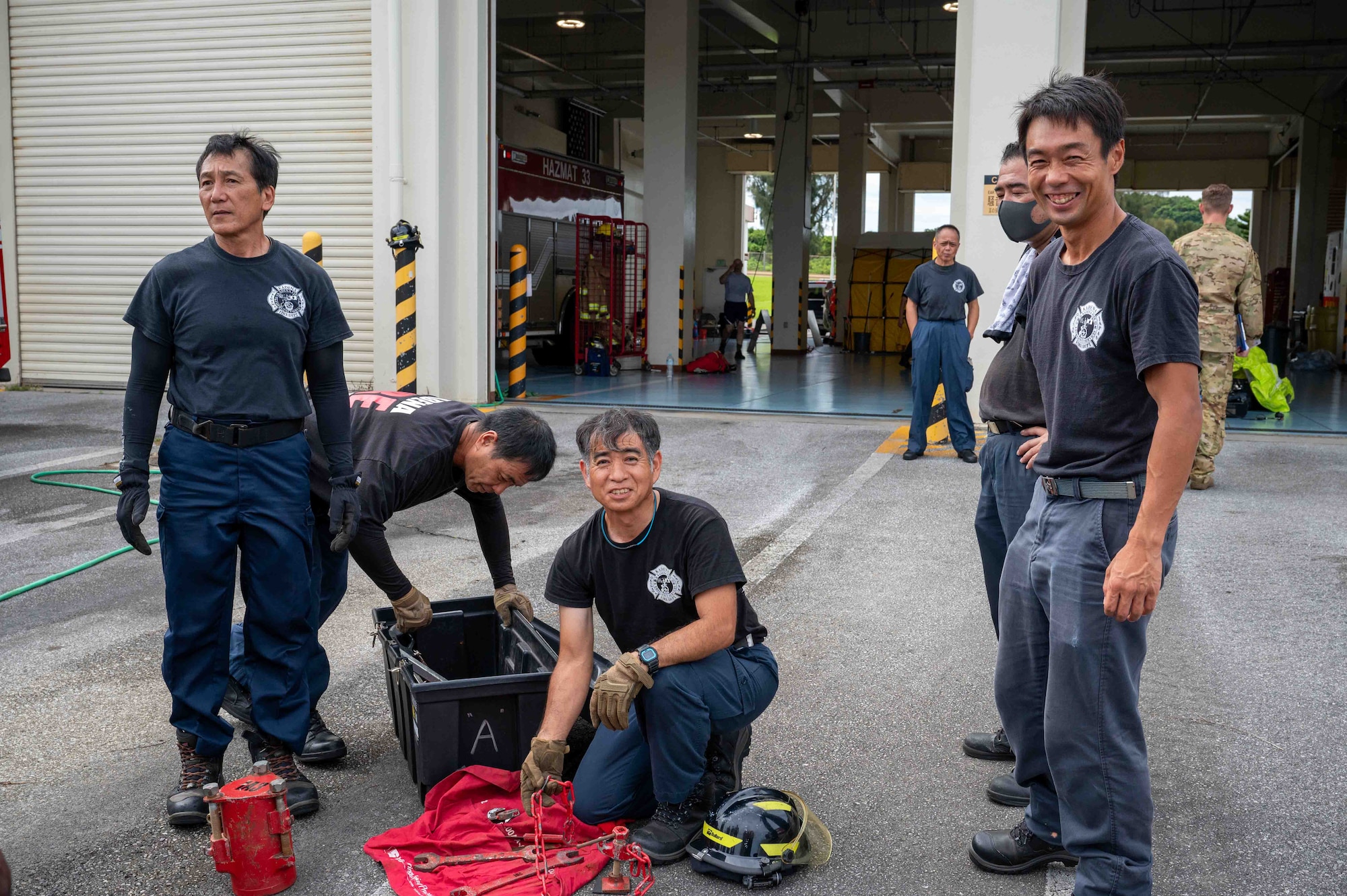 firefighters smile at the camera during a training
