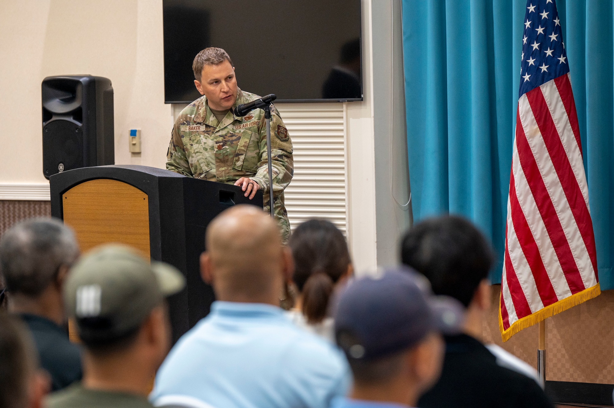 U.S. Air Force Maj. Dominic Baker, Defense Logistics Agency Energy Okinawa incoming commander, gives remarks during a change of command at Kadena Air Base, Japan, June 18, 2025