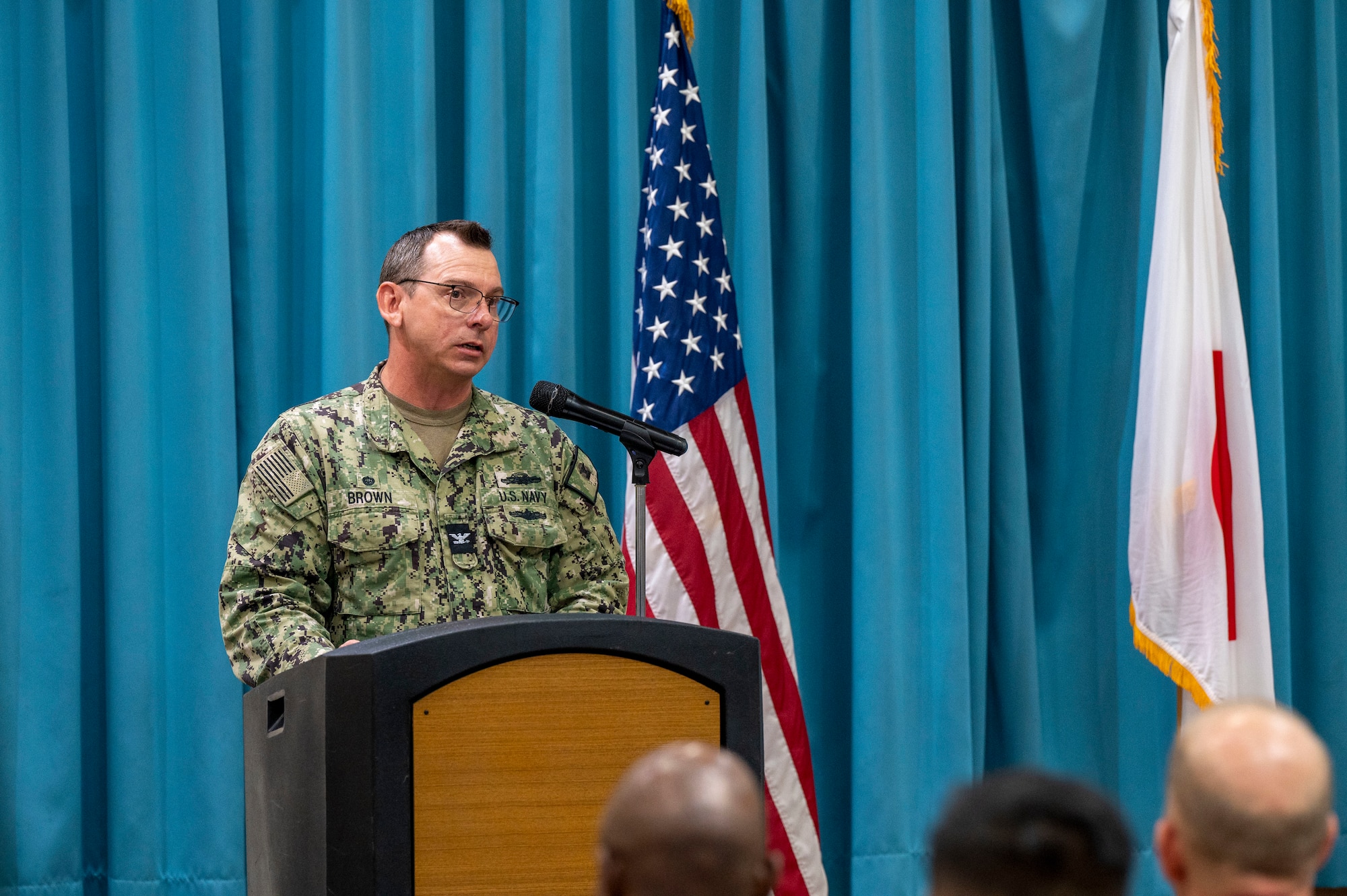 U.S. Navy Capt. Patrick Brown, Defense Logistics Agency Indo-Pacific commander, gives remarks during a change of command ceremony at Kadena Air Base, Japan, June 18, 2025