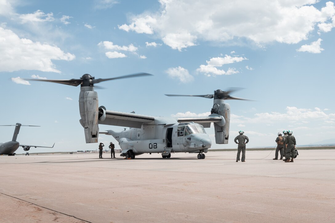 U.S. Marines with Marine Medium Tiltrotor Squadron 261 (VMM-261) observe the startup of an MV-22 Osprey aircraft before a familiarization flight at Peterson Space Force Base, Colorado, June 16, 2025 As the air combat element of the Special Purpose Marine Air-Ground Task Force – Alert Contingency MAGTF (SPMAGTF-ACM), VMM-261 conducted a deployment for training to increase the squadron’s proficiency in high altitude aviation operations and improve overall combat readiness for any potential MAGTF missions. (U.S. Marine Corps photo by Cpl. Osmar VasquezHernandez)