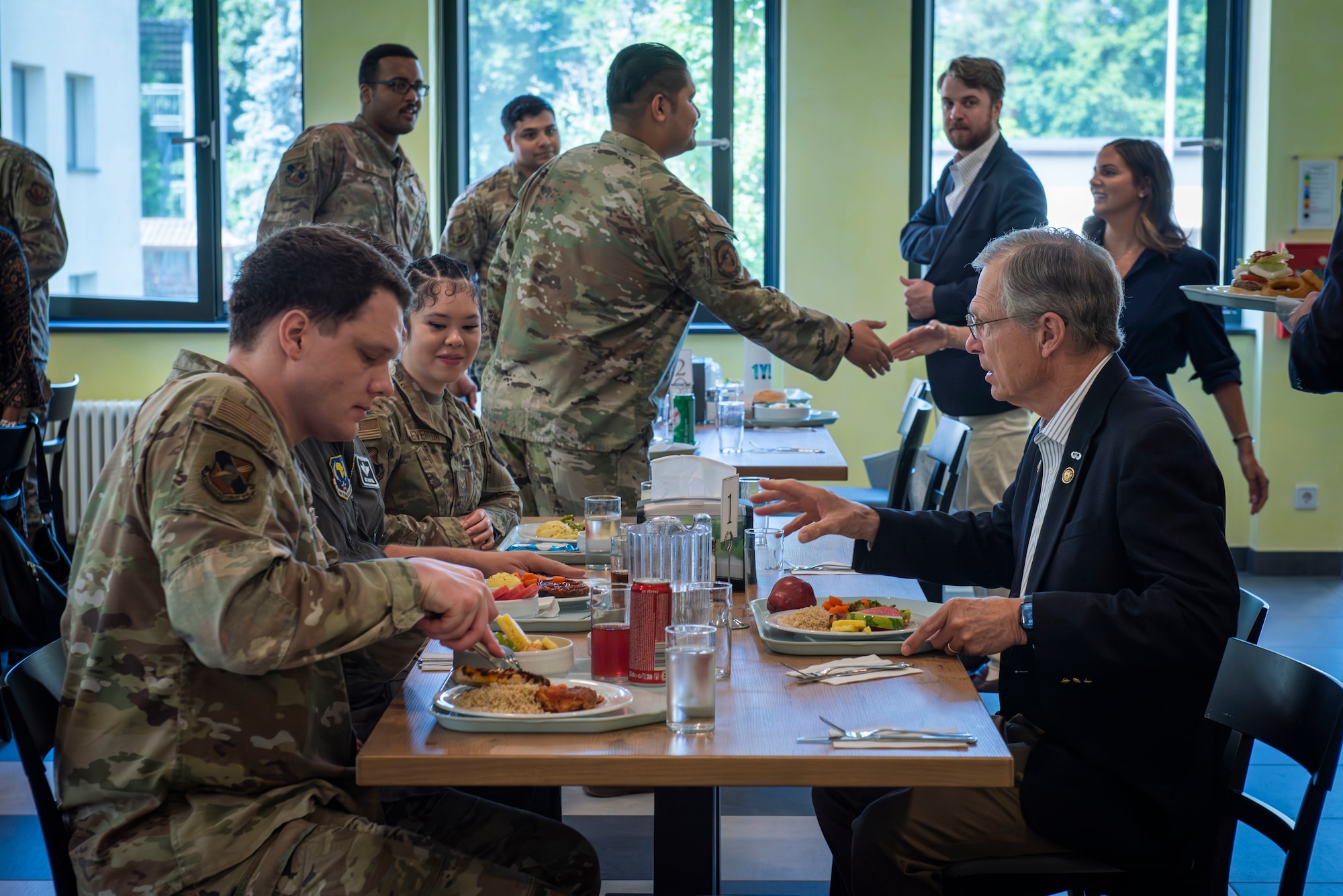Representative speaks with Airmen.