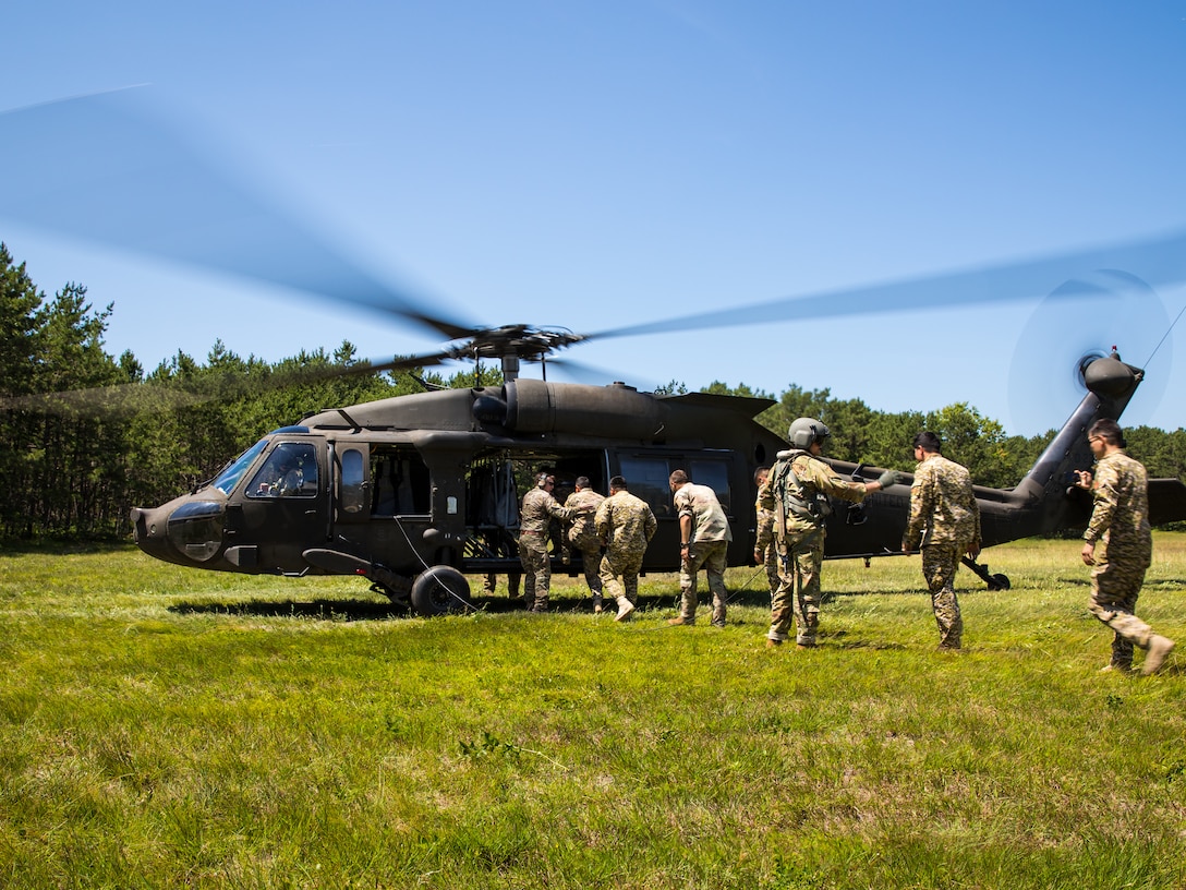 Partners participating in Regional Cooperation 25 board a UH-60 Black Hawk at Camp Edwards, Massachusetts, June 24rd, 2025. Regional Cooperation offers a great opportunity for Central Asian and South Asian countries to collaborate on stability operations, border security and control, as well as efforts to combat narcotics and weapons of mass destruction. (U.S. Army National Guard photo by Staff Sgt. Shawn Keeton)