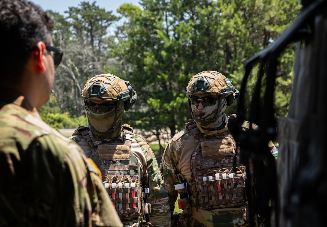 Two Uzbekistan soldiers receiving instruction at UH-60 familiarization during exercise Regional Cooperation 25 at Camp Edwards, Massachusetts June 24th, 2025. Regional Cooperation 25 is an annual, multinational U.S. Central Command-sponsored command-post and field training exercise conducted by National Guard units in partnership with Central and South Asian nations. (U.S. Army National Guard photo by Sgt. James Vaughan)
