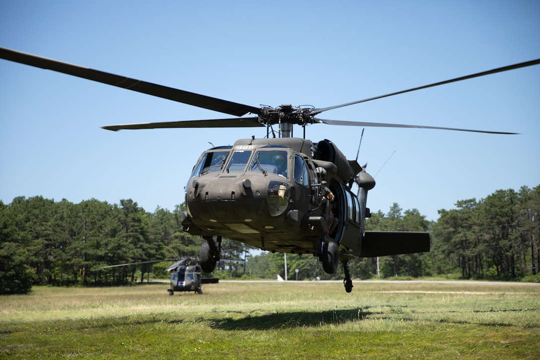 A UH-60 carrying soldiers from several countries at UH-60 familiarization during exercise Regional Cooperation 25 at Camp Edwards, Massachusetts June 24th, 2025. Regional Cooperation 25 is an annual, multinational U.S. Central Command-sponsored command-post and field training exercise conducted by National Guard units in partnership with Central and South Asian nations. (U.S. Army National Guard photo by Sgt. James Vaughan)