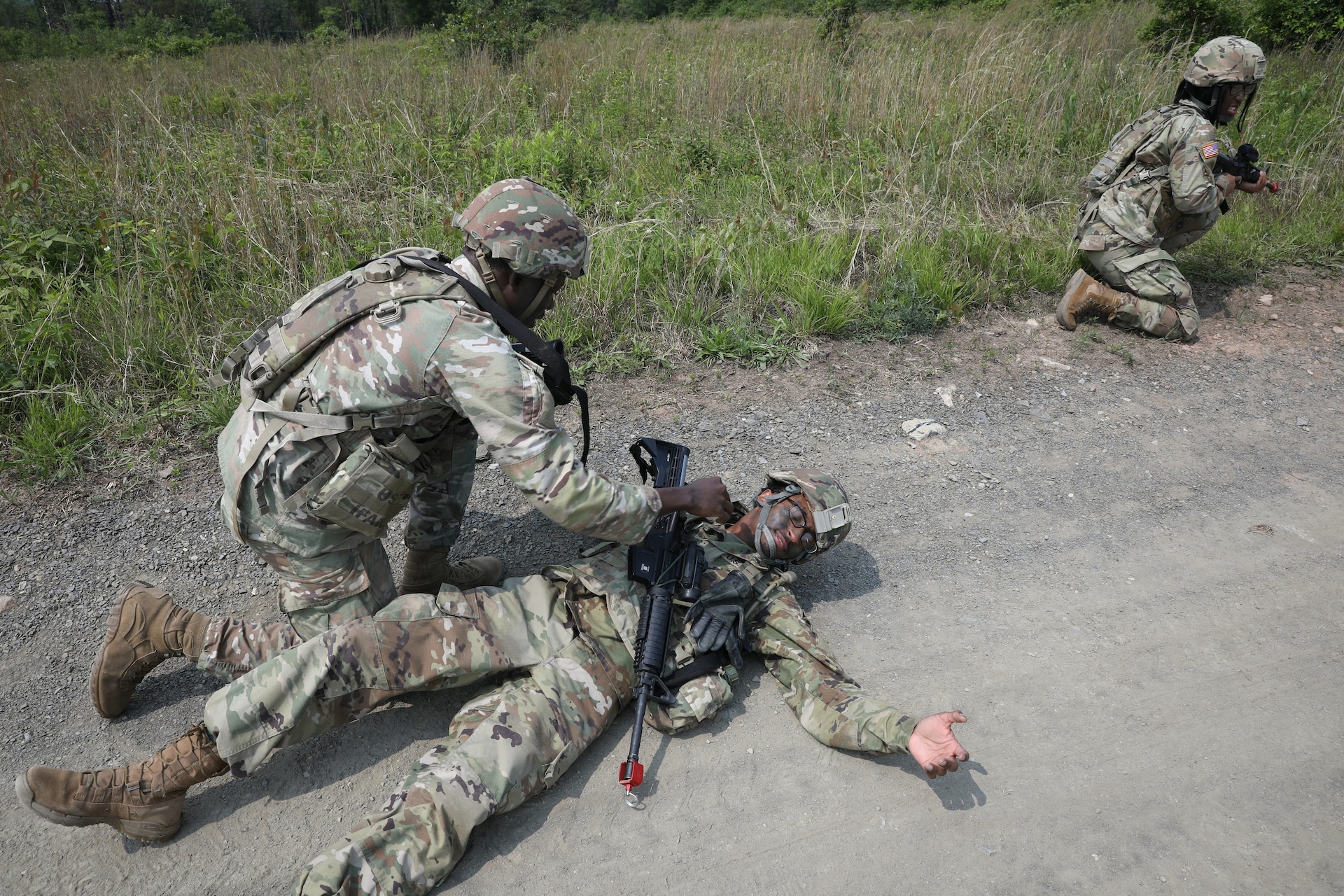 Soldiers with the 1946th Finance Company simulate care while executing squad movement drills at Fort Indiantown Gap, Pa., June 03, 2025. Squad movement drills are a fundamental soldiering skills, and especially crucial as finance units can be assigned to support various types of units across the Army. (U.S. Army Photo by Spc. Carrol Hughes)