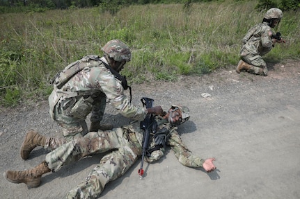 Soldiers with the 1946th Finance Company simulate care while executing squad movement drills at Fort Indiantown Gap, Pa., June 03, 2025. Squad movement drills are a fundamental soldiering skills, and especially crucial as finance units can be assigned to support various types of units across the Army. (U.S. Army Photo by Spc. Carrol Hughes)