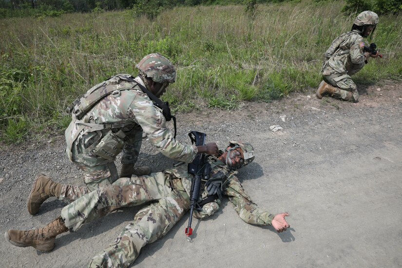 Soldiers with the 1946th Finance Company simulate care while executing squad movement drills at Fort Indiantown Gap, Pa., June 03, 2025. Squad movement drills are a fundamental soldiering skills, and especially crucial as finance units can be assigned to support various types of units across the Army. (U.S. Army Photo by Spc. Carrol Hughes)