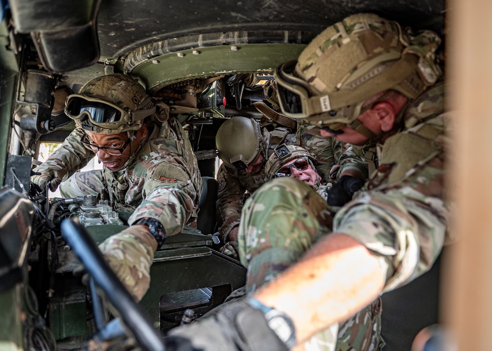 Airmen with the 910th Security Forces Squadron, Youngstown Air Reserve Station, Ohio, perform downed driver training at Moody Air Force Base, Georgia, June 20, 2025. Members of the 910th SFS traveled to Moody to complete their annual tour and focused on combat readiness and tactical skills. (U.S. Air Force photo by Senior Airman Leonid Soubbotine)