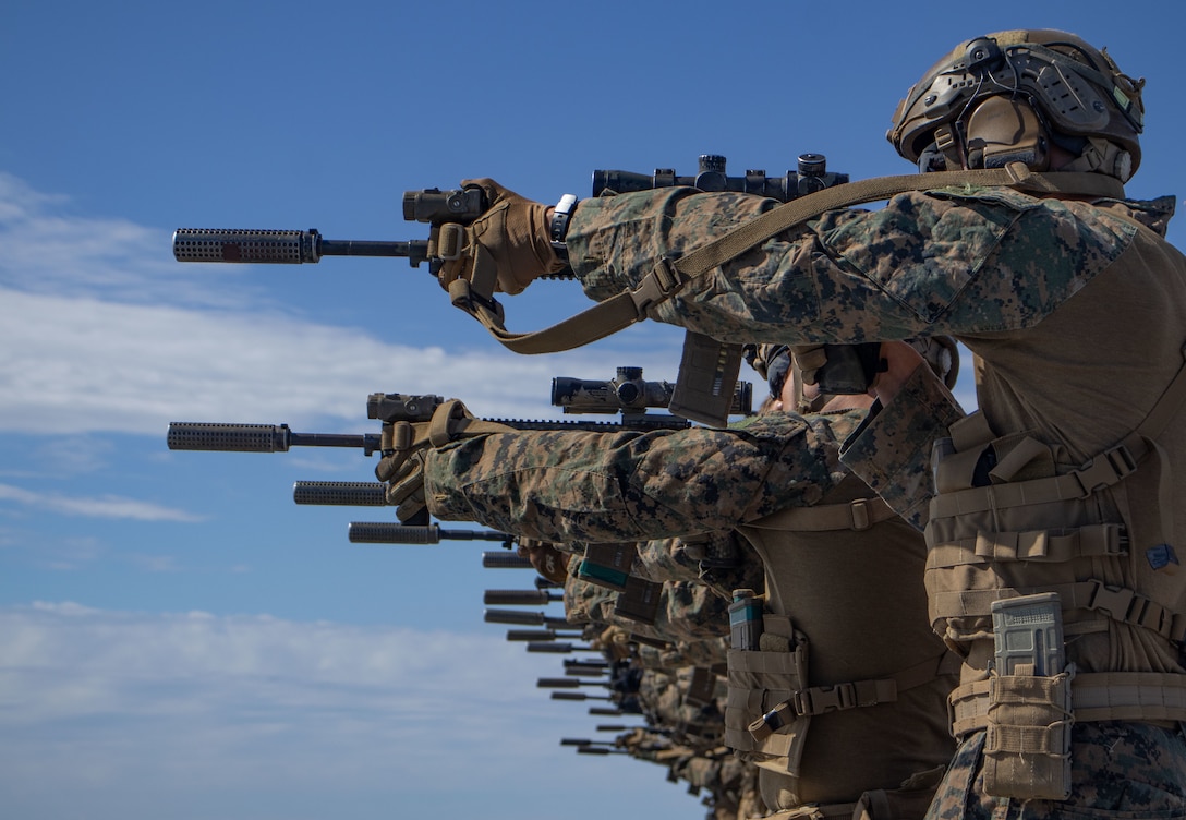 U.S. Marines with Baker Company, Battalion Landing Team 1st Battalion, 7th Marine Regiment, 31st Marine Expeditionary Unit, fire at targets during a live-fire deck shoot aboard amphibious transport dock USS San Diego (LPD 22), in the Timor Sea, June 12, 2025. (U.S. Marine Corps photo by Lance Cpl. Trevor BishopWilliams)