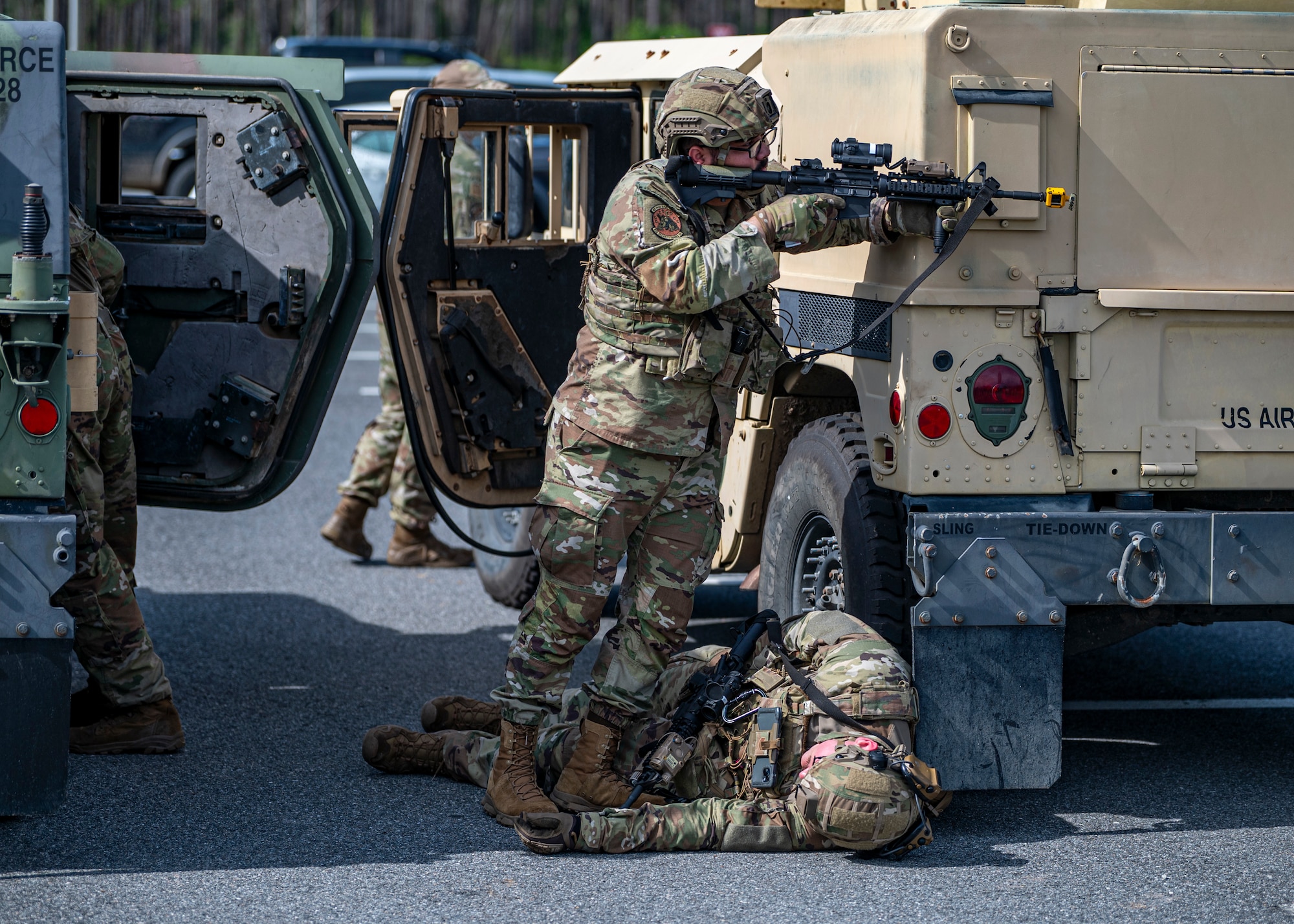 Airmen with the 910th Security Forces Squadron, Youngstown Air Reserve Station, Ohio, perform transfer drills at Moody Air Force Base, Georgia, June 20, 2025. Airmen rehearsed scenarios involving vehicle ambushes, practicing rapid gear transfer and tactical movement under pressure to reinforce convoy survival skills and perimeter security. (U.S. Air Force photo by Senior Airman Leonid Soubbotine)