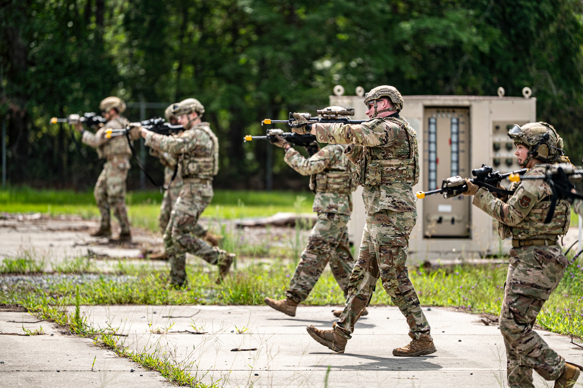 Airmen with the 910th Security Forces Squadron, Youngstown Air Reserve Station, Ohio, perform a sweep at Moody Air Force Base, Georgia, June 20, 2025. Airmen practiced tactical line formation during an area sweep for a simulated threat, honing their coordination, spacing, and situational awareness in a combat environment. (U.S. Air Force photo by Senior Airman Leonid Soubbotine)