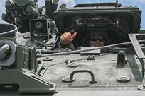 army soldiers parking Stryker combat vehicles