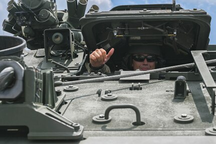 army soldiers parking Stryker combat vehicles