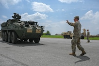 army soldiers parking Stryker combat vehicles