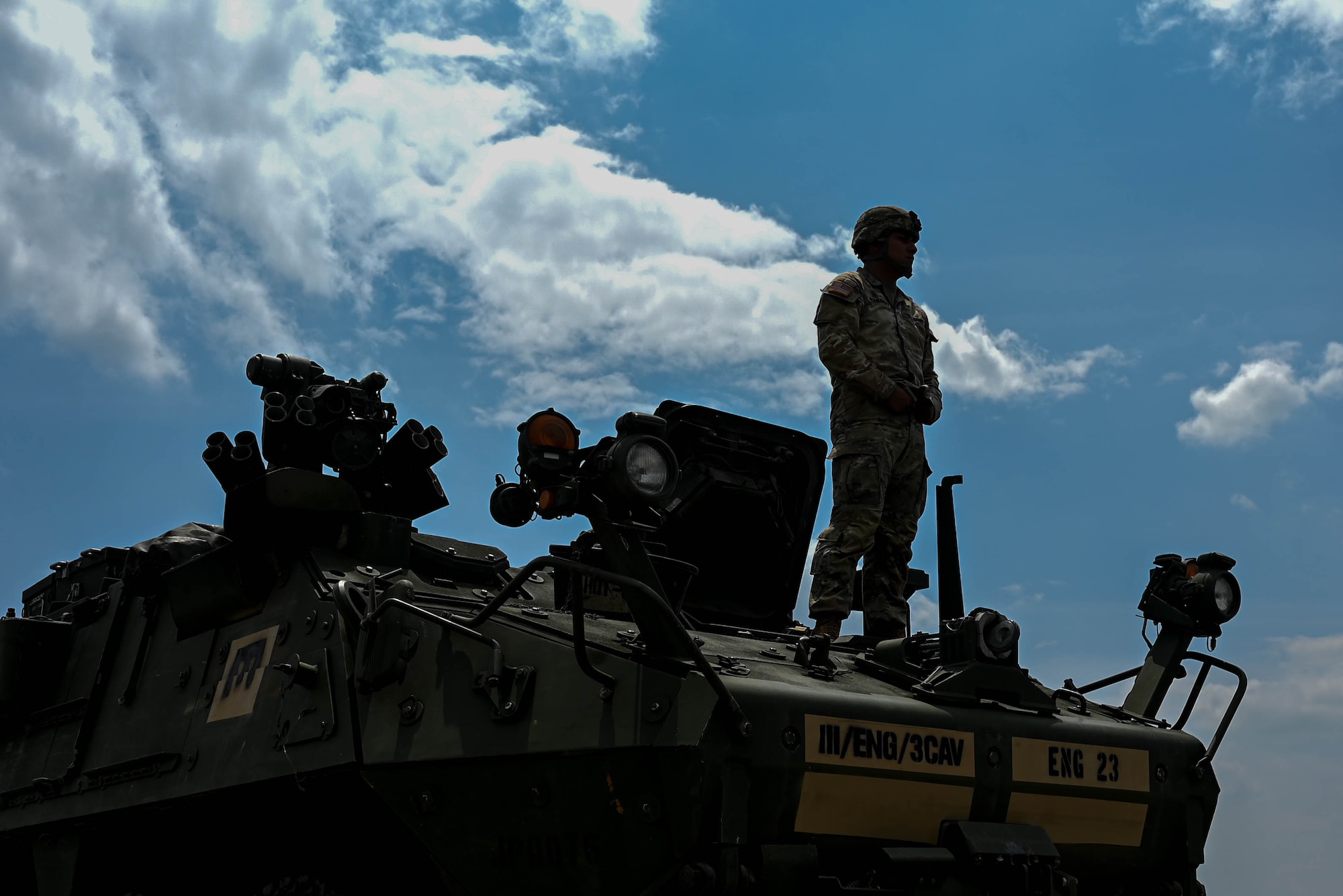 army soldiers parking Stryker combat vehicles