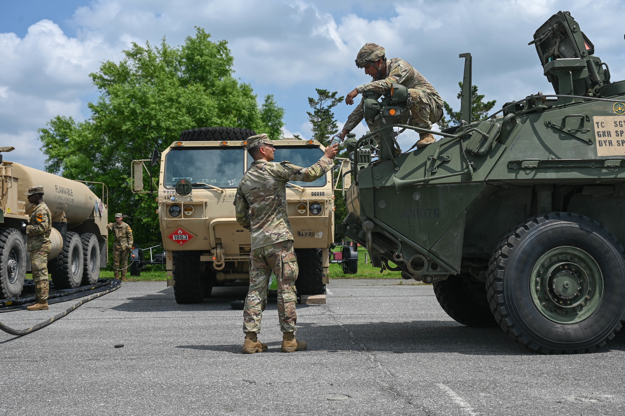 army soldiers parking Stryker combat vehicles