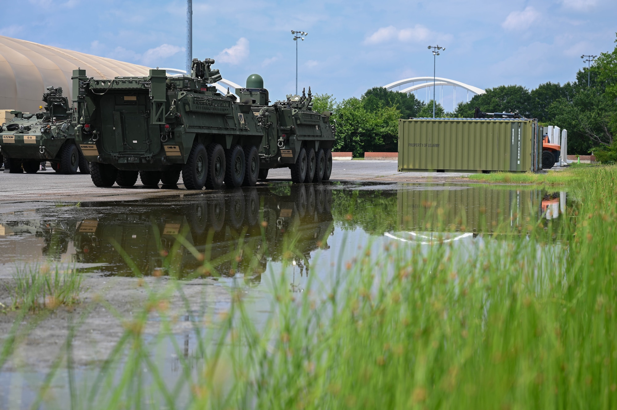 army soldiers parking Stryker combat vehicles