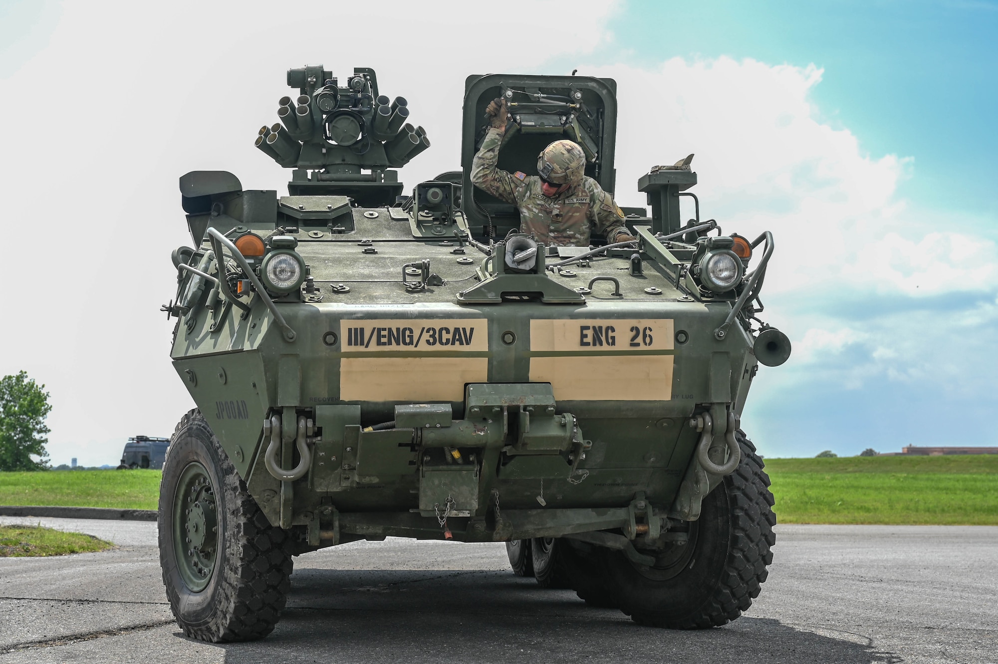 army soldiers parking Stryker combat vehicles