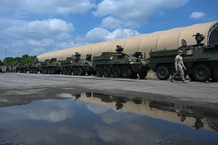 army soldiers move Stryker vehicles