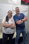 Rebecca Cozzo, ISC issue resolution specialist, and Jeff Engel, ISC chair, pose for a photo in their office.