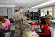 Sgt. 1st Class Justin Craggs displays one of his personal protective equipment pieces to a Northwest Special Recreation Association attendee during the NWSRA’s Pursuit program, June 17, 2025. The Soldiers there discussed the roles of the Army and shared their personal stories of military service with the audience members.
(U.S. Army Reserve Photo by Staff Sgt. David Lietz)