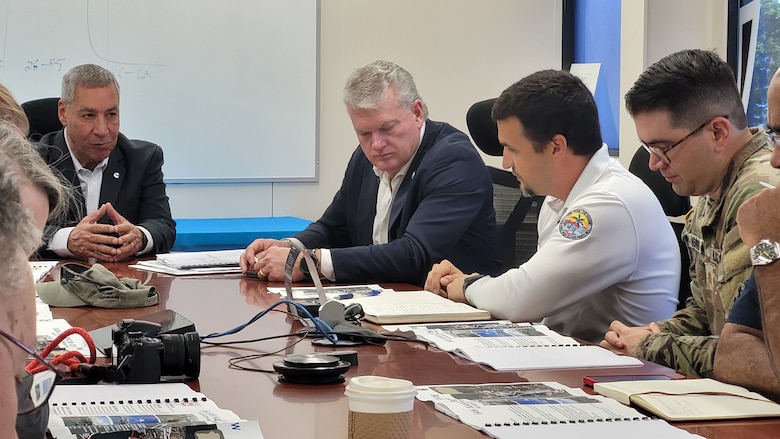 At the Crowley import/export facilities in San Juan, Puerto Rico, Chief of the Caribbean District Civil Works Mega Program Branch Jose D. Bilbao (center right) briefs Congressman Mike Collins (R-Ga.) on regional Corps of Engineers projects.