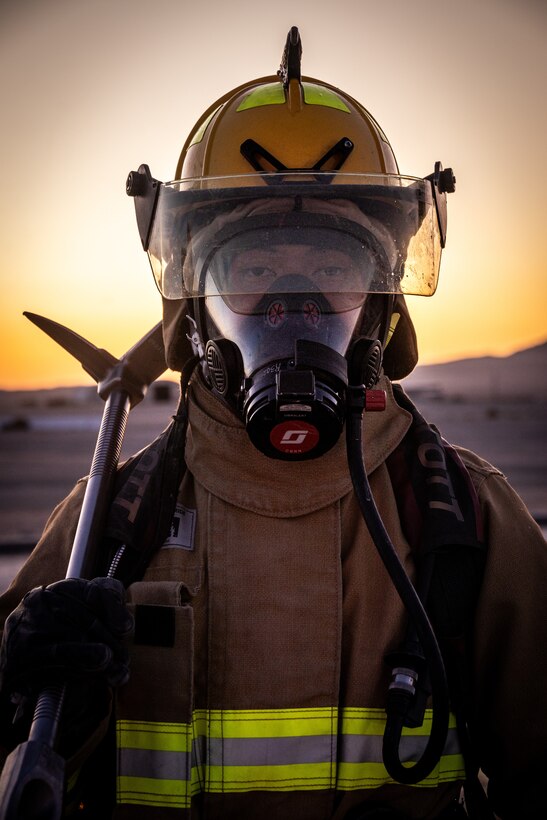 U.S. Marine Corps Lance Cpl. Joseph Vasquez, a firefighter, with Aircraft Rescue and Fire Fighting, Marine Wing Support Squadron 472, 4th Marine Aircraft Wing, pulls a fire hose during a simulated aircraft fire-fighting drill at Integrated Training Exercise 3-25, Marine Corps Air Ground Combat Center, Twentynine Palms, California, June 17, 2025. ITX is a critical Marine Air-Ground Task Force exercise for the Marine Forces Reserve’s training cycle, confirming unit readiness through live-fire and combined-arm integration. (U.S. Marine Corps photo by Lance Cpl. Edward Spears)