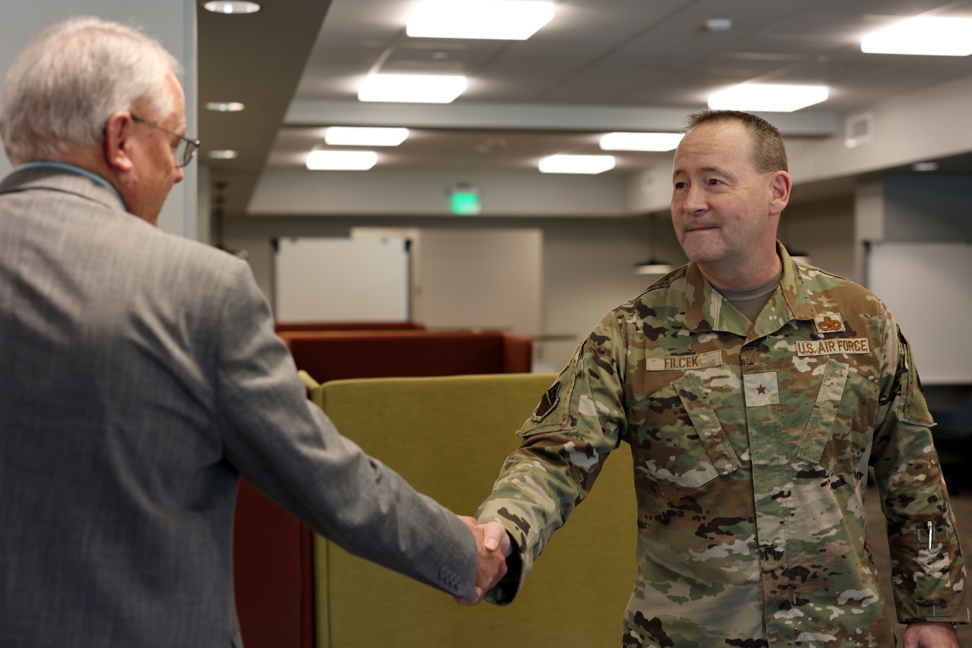 82nd Training Wing commander Brig. Gen. Paul Filcek shakes Chairman of the Sheppard Military Affairs Committee Glen Barham's hand.