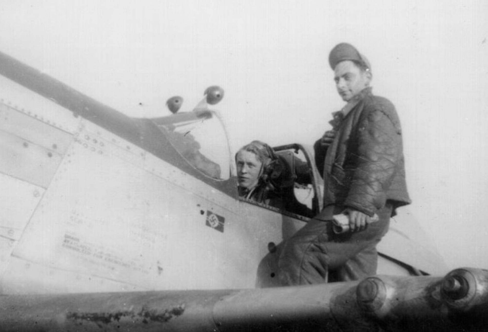 A World War II veteran, then 1st Lt Richard C. Penrose flew the P-51 Mustang in the 504th Fighter Squadron, 339th Fighter Group of the Mighty Eighth Air Force in the European Theater of Operations.  He is seen here in the cockpit during that war, presumably with his crew chief on the wing, and achieved one aerial victory over a German Me-109 on August 16, 1944.  Lt. Penrose knocked down a number of enemy barrage balloons too, though these were uncredited.  (Photo courtesy of Mr. Jack Cook)