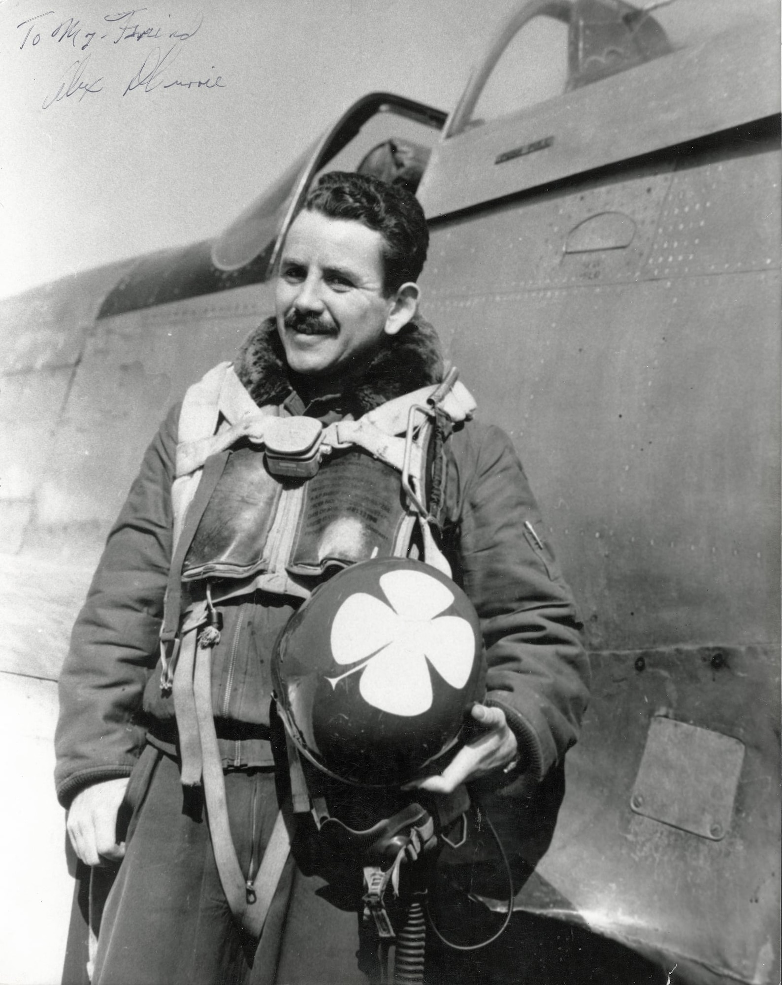 Capt. Alex Currie after his aerial combat of January 22, 1951 near Pyongyang, North Korea, holds on to one of the 39th FIS “standardized” helmets, his good luck charm painted in Air Force blue with a large, white four-leaf clover.  This helmet project was largely accomplished by the end of February, 1951.  (Photo courtesy of Mr. Jack Cook)