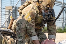An Airman assigned to the 91st Security Forces Group tends to an injured civilian during a mass casualty exercise outside of Minot Air Force Base, North Dakota, June 17, 2025. Personnel during mass casualty exercises are able to work on rapid communication and response while identifying any strengths and weaknesses in trauma skills, communication, transportation, and casualty management.