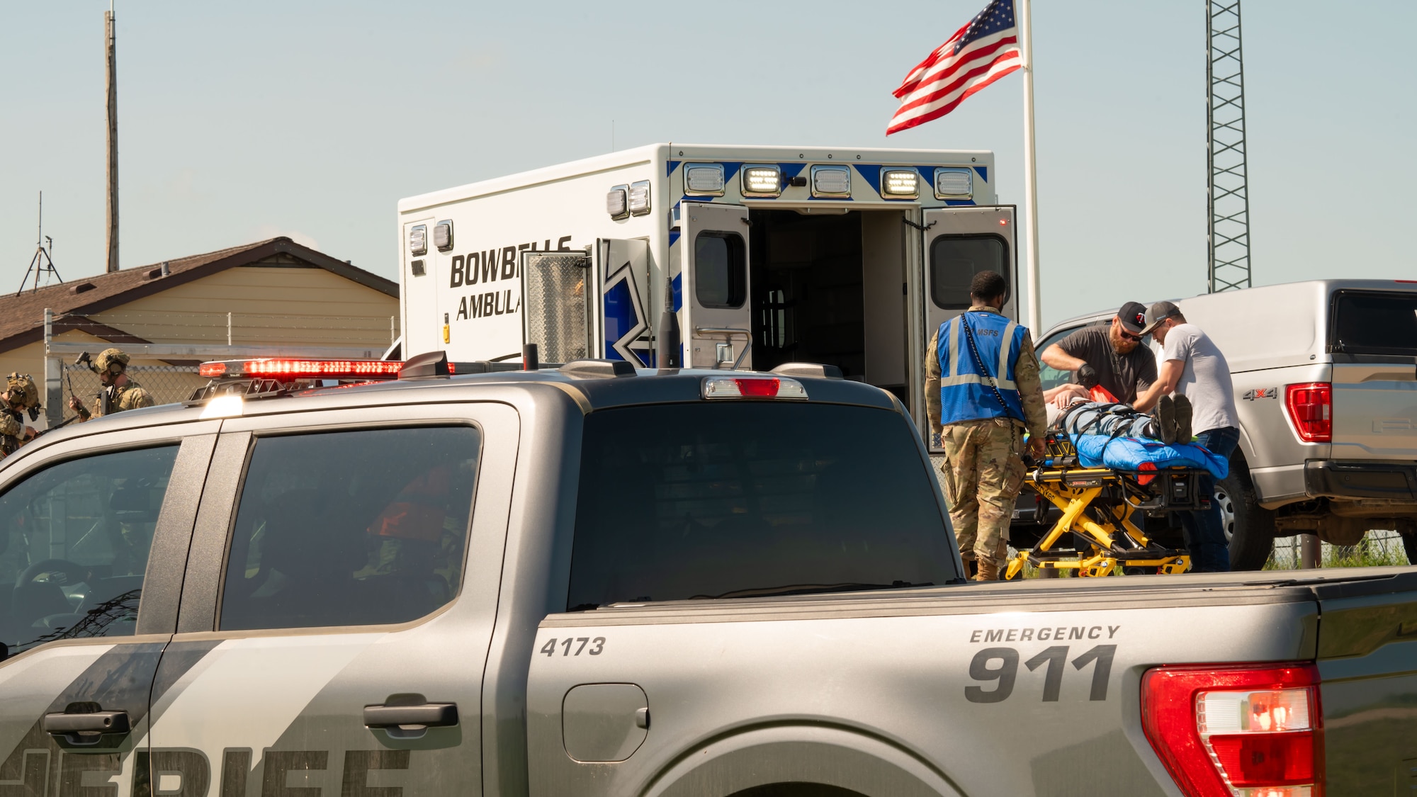 Team Minot Airmen collaborate with local first responders during a mass casualty exercise outside of Minot Air Force Base, North Dakota, June 17, 2025. Personnel during mass casualty exercises are able to work on rapid communication and response while identifying any strengths and weaknesses in trauma skills, communication, transportation, and casualty management.