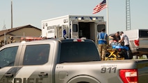 Team Minot Airmen collaborate with local first responders during a mass casualty exercise outside of Minot Air Force Base, North Dakota, June 17, 2025. Personnel during mass casualty exercises are able to work on rapid communication and response while identifying any strengths and weaknesses in trauma skills, communication, transportation, and casualty management.