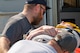 First responders load an injured man lying on a gurney during a mass casualty exercise outside of Minot Air Force Base, North Dakota, June 17, 2025. The exercise was in conjunction with the 91st Security Forces Group and 54th Helicopter Squadron as well as local first responders in an attempt to strengthen communication and response time.