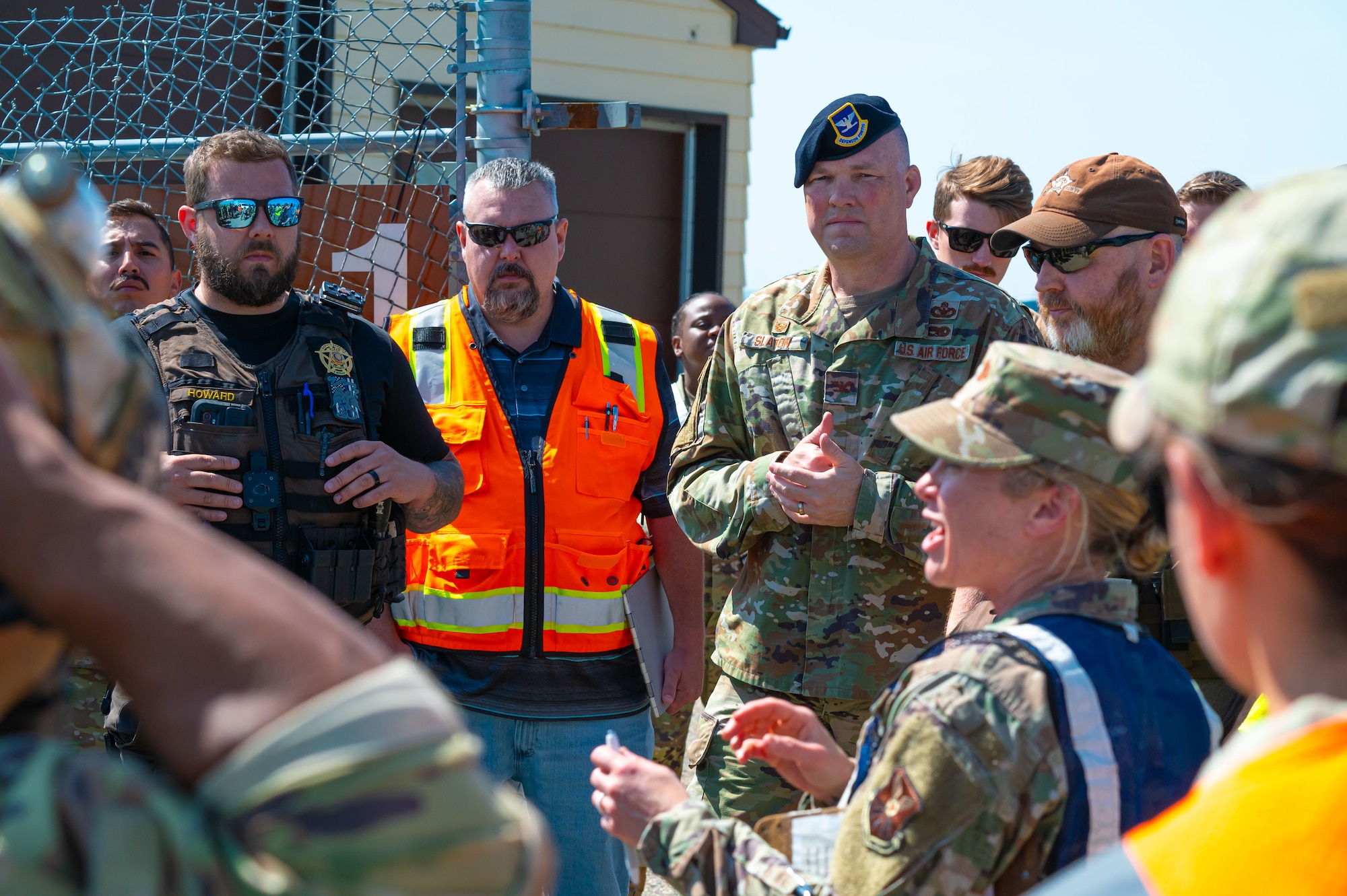 Team Minot mass casualty exercise leads discuss lessons learned during the exercise at missile alert facility outside of Minot Air Force Base, North Dakota, June 17, 2025. This partnership allows local law enforcement to gain firsthand experience with military procedures during active shooter scenarios.