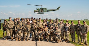 91st Security Forces Group and the 54th Helicopter Squadron pose for a group photo at a missile alert facility outside of Minot Air Force Base, North Dakota, June 17, 2025. 91SFG, 54HS took part in a mass casualty exercise alongside local police and paramedics.