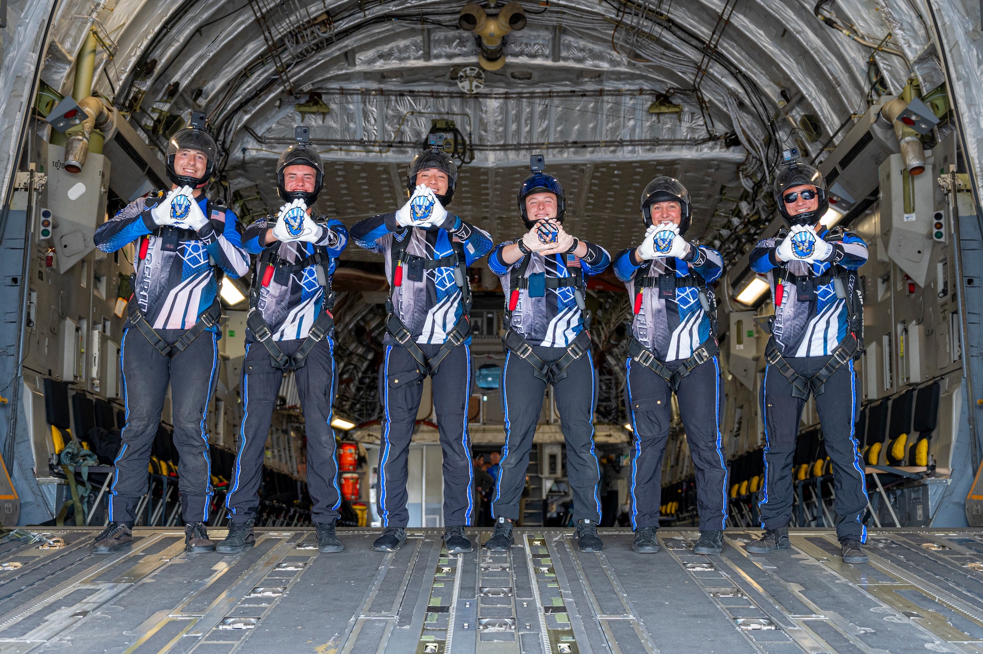 U.S. Air Force Academy cadets with the Wings of Blue parachute team stand on a C-17 Globemaster III ramp during the 2025 Moses Lake Airshow at Grant County International Airport, Washington, June 19, 2025.
