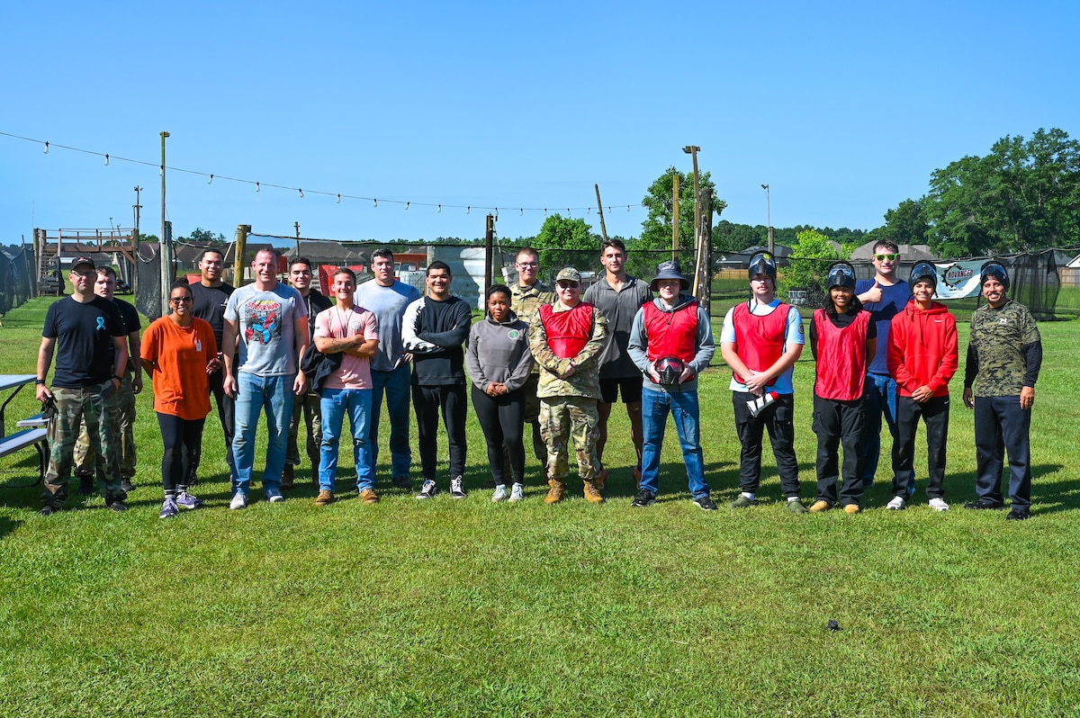 Airmen from the 42nd Contracting Squadron and 42nd Security Forces Squadron pose for a photo during a resiliency and readiness paintball exercise in Wetumpka, Alabama, June 20, 2025.