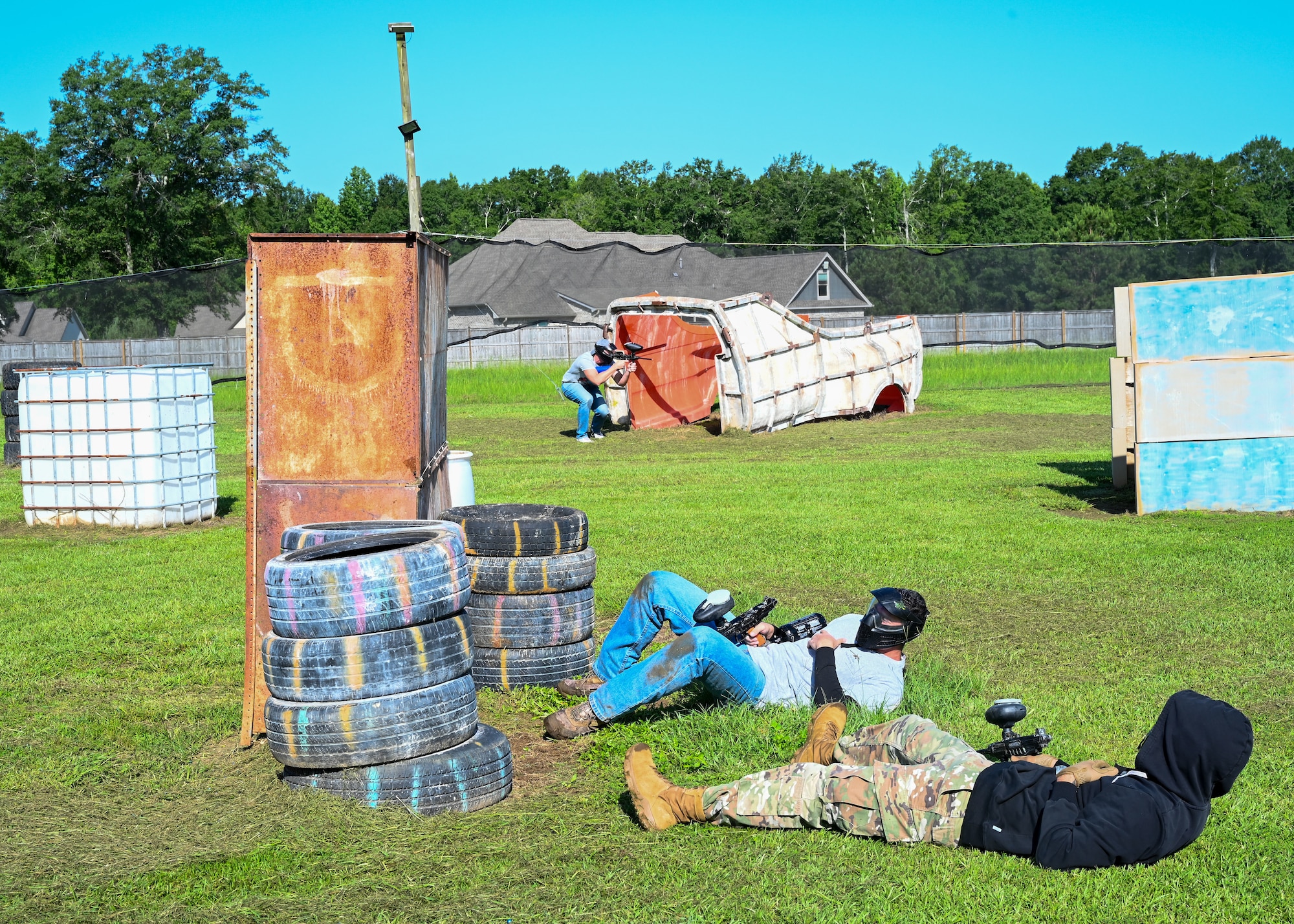 Airmen from the 42nd Contracting Squadron wait to be revived by a medic during a simulated resiliency and readiness paintball exercise in Wetumpka, Alabama, June 20, 2025.